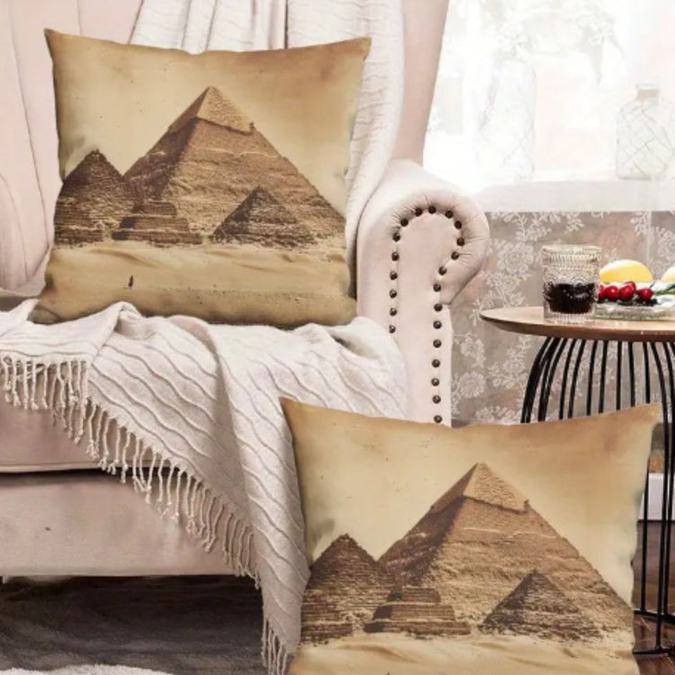 Two beige pyramid-print cushion covers displayed on an armchair and the floor.