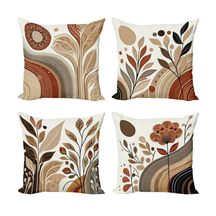 Four cream cushion covers with rust, tan and brown abstract botanical patterns.