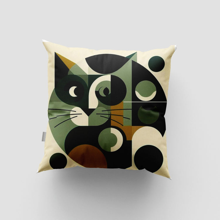 Cream cushion cover with a large geometric green and black cat face.