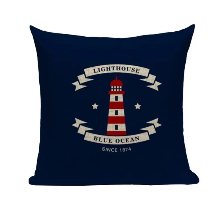 Navy cushion cover with a red and white lighthouse, small stars and cream ribbon lettering.
