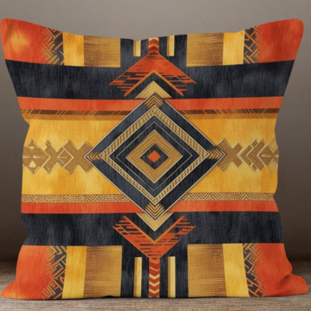 Cushion cover with a large navy and mustard diamond over orange and grey stripes.
