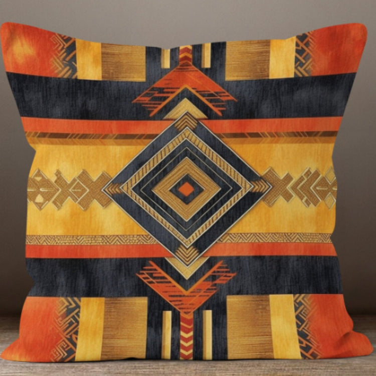 Cushion cover with a large navy and mustard diamond over orange and grey stripes.
