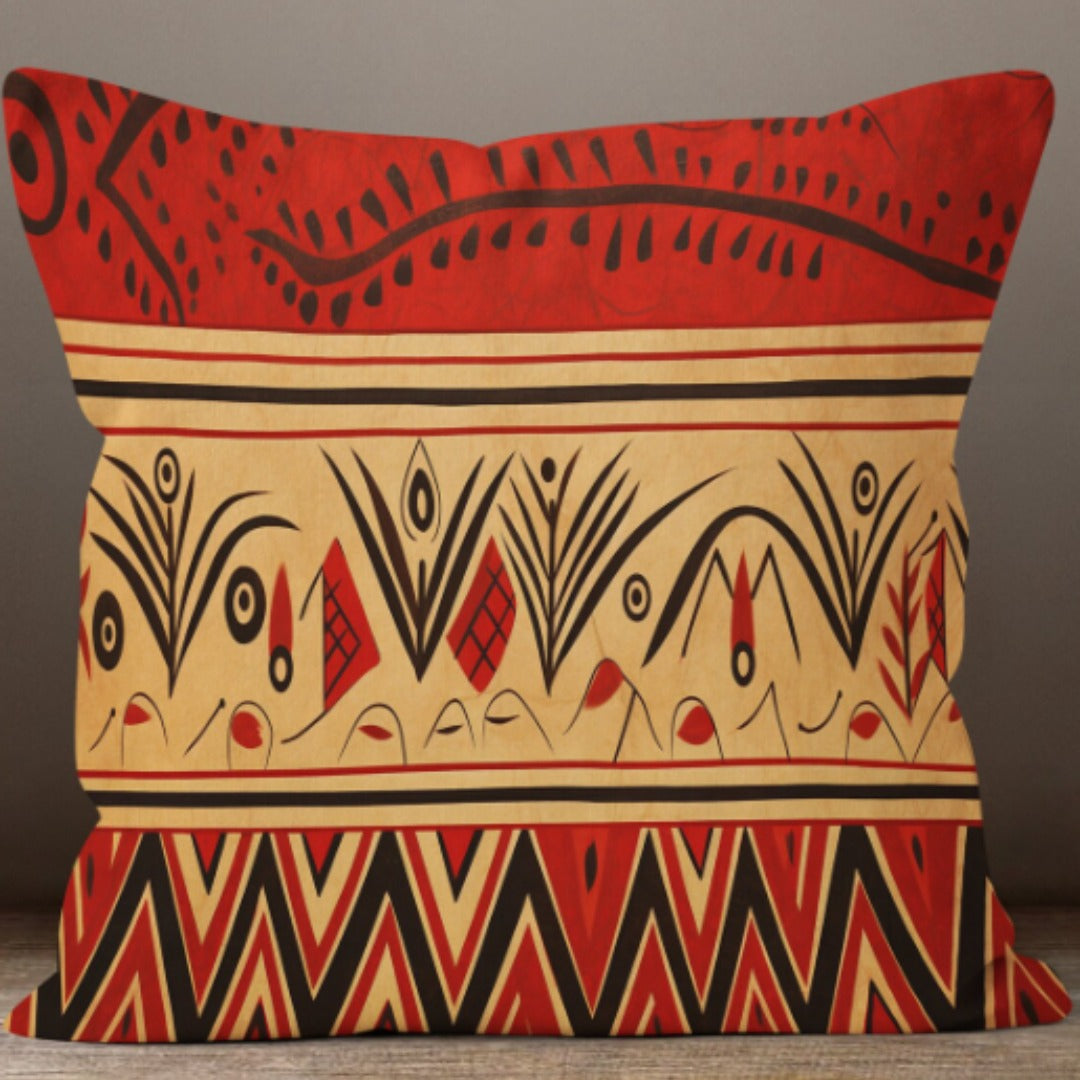 Cushion cover with red, cream and black horizontal bands of curved lines and triangles.