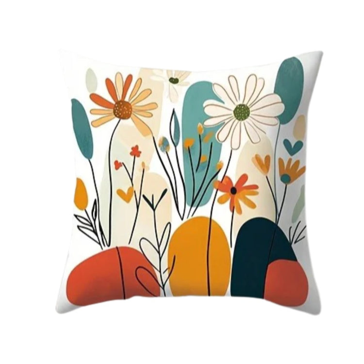 Cream cushion cover with delicate multicoloured flowers over teal, coral and mustard shapes.