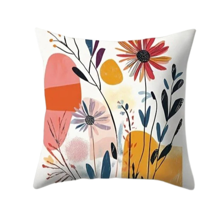 Cream cushion cover with coral and red flowers, dark leafy stems and mustard shapes.