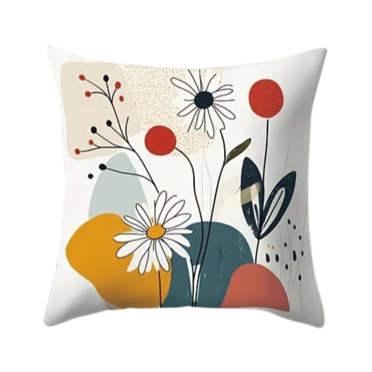 White cushion cover with fine flower drawings, dark leaves and mustard, coral and teal shapes.