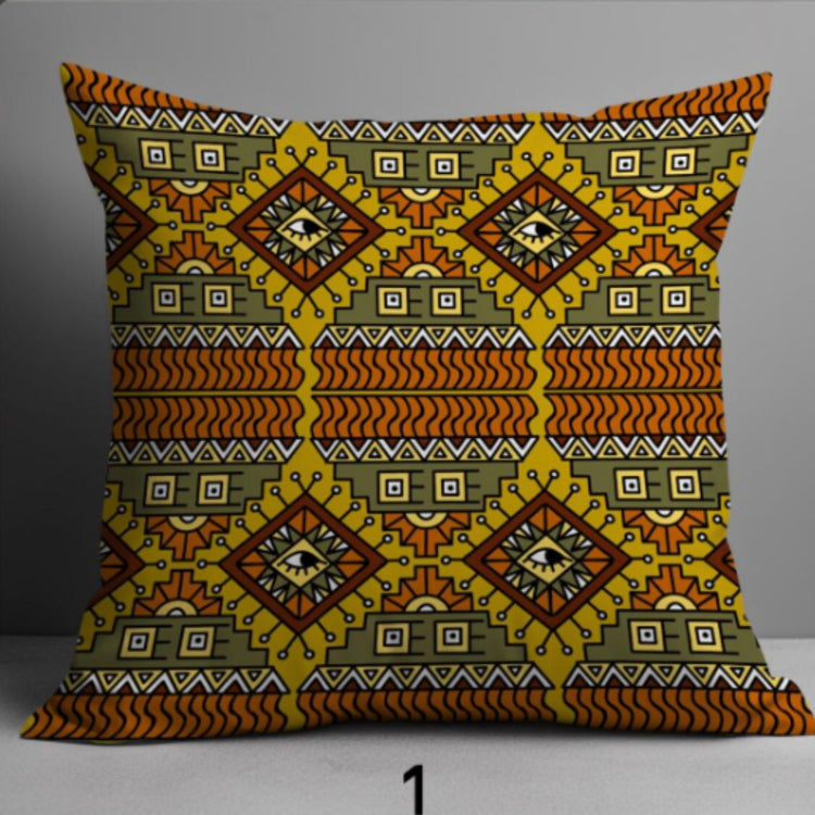 Cushion cover with mustard, green, rust and black horizontal patterns and large diamonds.