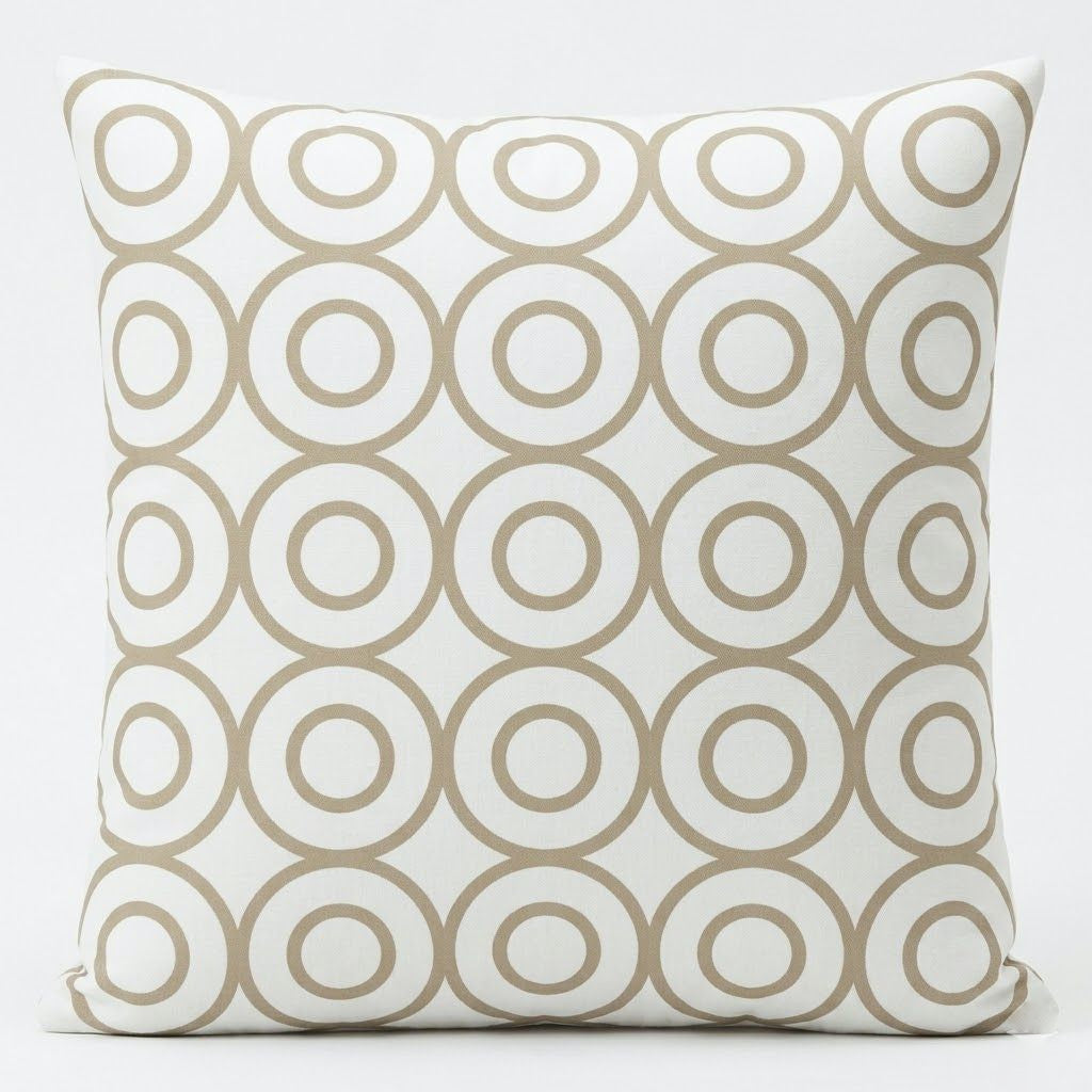 Cream cushion cover with repeating beige outlined circles.