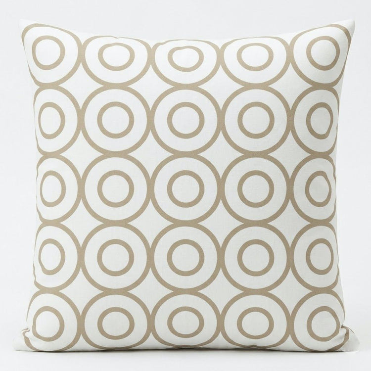 Cream cushion cover with repeating beige outlined circles.