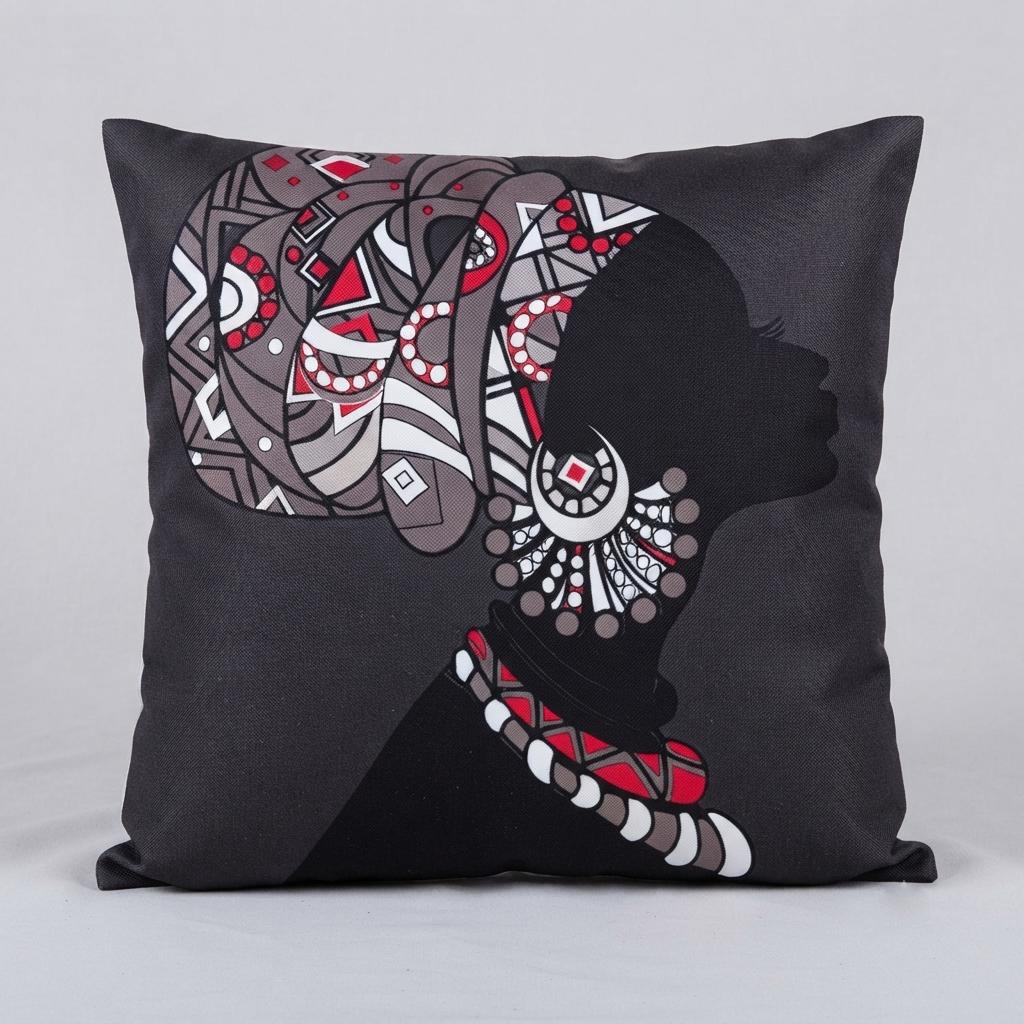 Grey cushion cover with a woman's profile, patterned headwrap and red jewellery details.