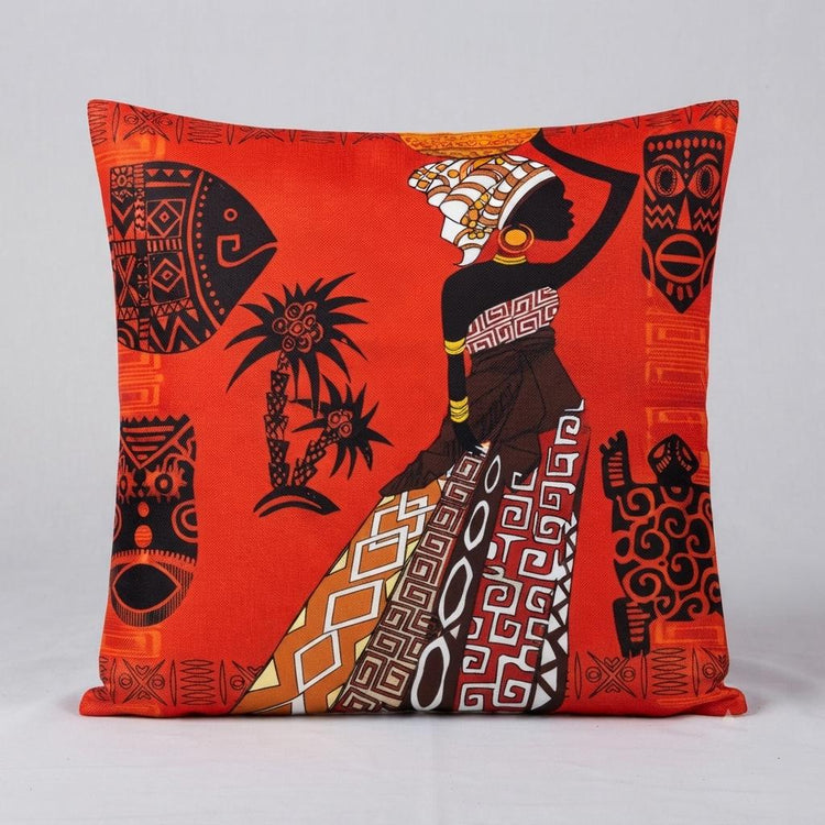 Red cushion cover with an illustrated woman in patterned clothing and decorative motifs.