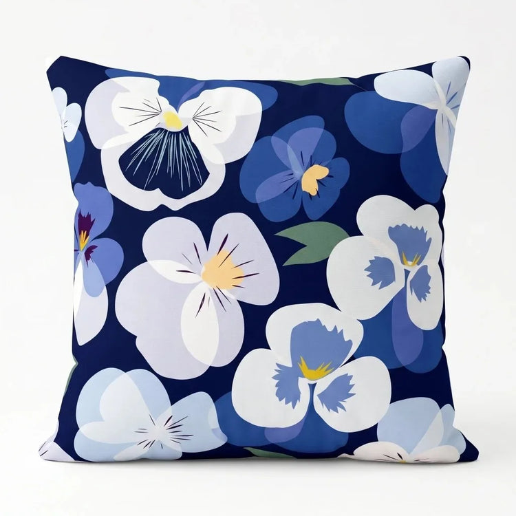 Navy cushion cover with large white and pale blue flowers.