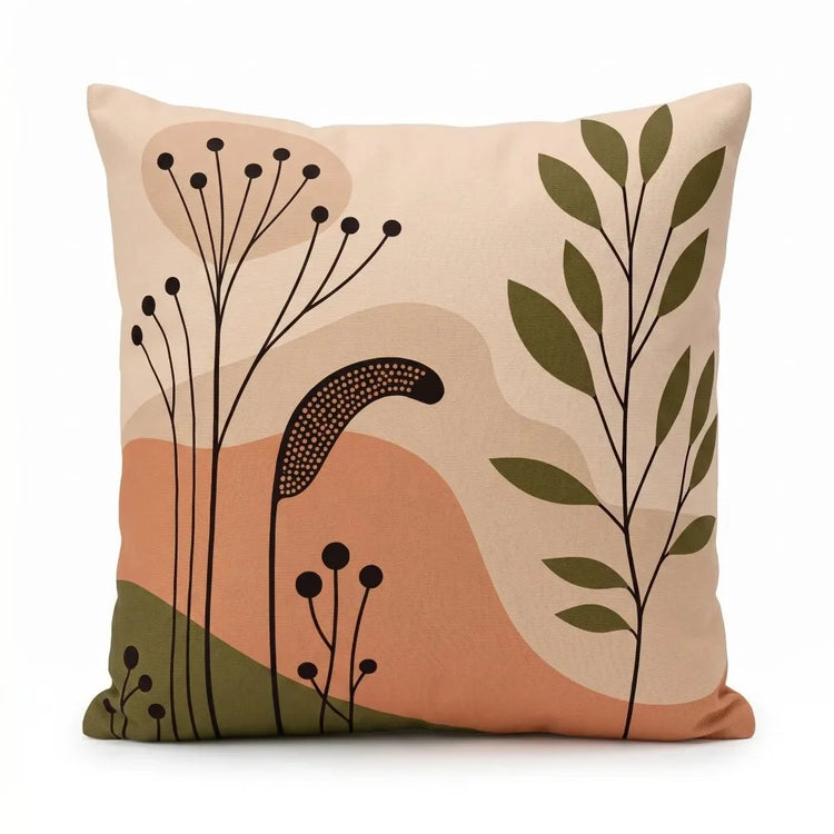Peach cushion cover with fine black seed heads, green leaves and earthy abstract shapes.