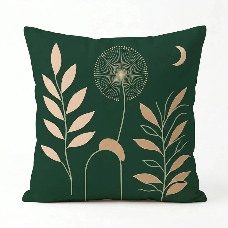 Dark green cushion cover with pale leaves, a delicate seed head and a crescent moon.