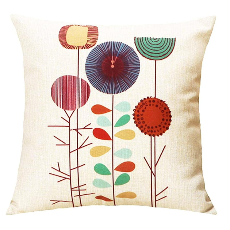 Cream cushion cover with tall red, purple, teal and orange circular flowers.