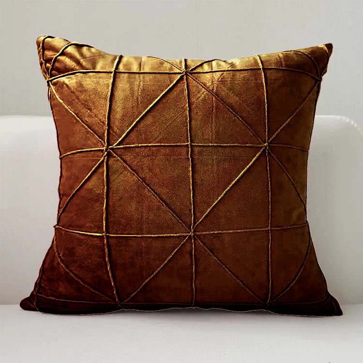 Brown cushion cover with intersecting geometric stitched lines.