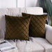 Two dark brown cushion covers with diamond stitching on a sofa.