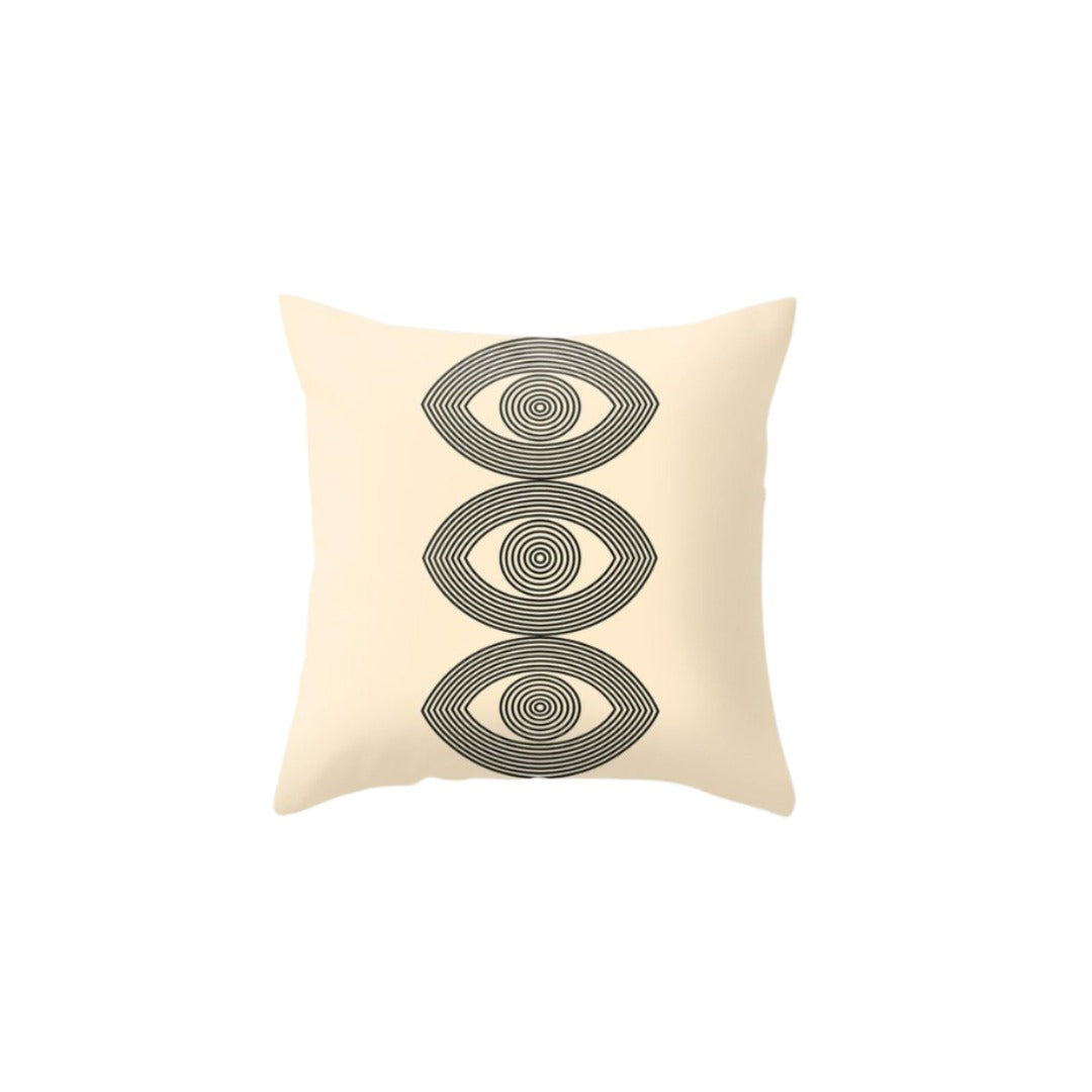 Cream cushion cover with three stacked grey eye-like oval motifs.
