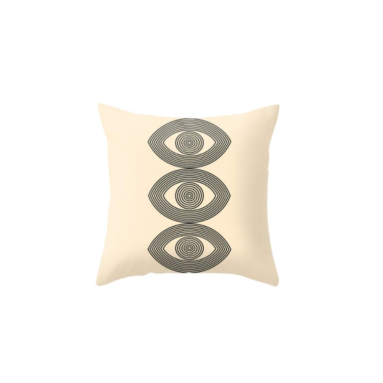 Cream cushion cover with three stacked grey eye-like oval motifs.