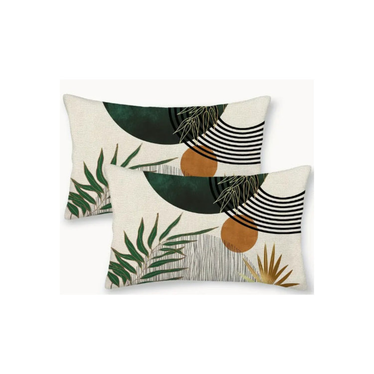 Two rectangular cream cushion covers with green leaves, ochre circles and black curved lines.