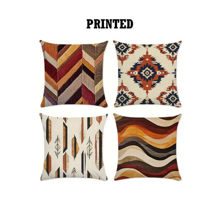 Four cushion covers with rust, brown, cream and black geometric prints.
