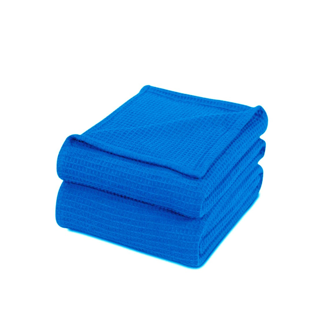 Folded bright blue waffle-weave cotton thermal blanket.