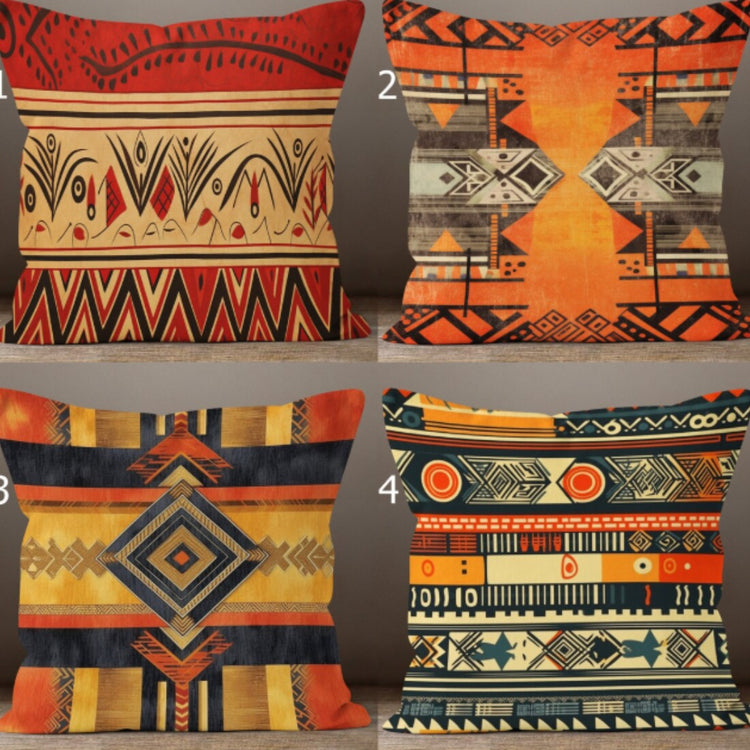 Four cushion covers with warm orange, rust, black and cream geometric patterns.