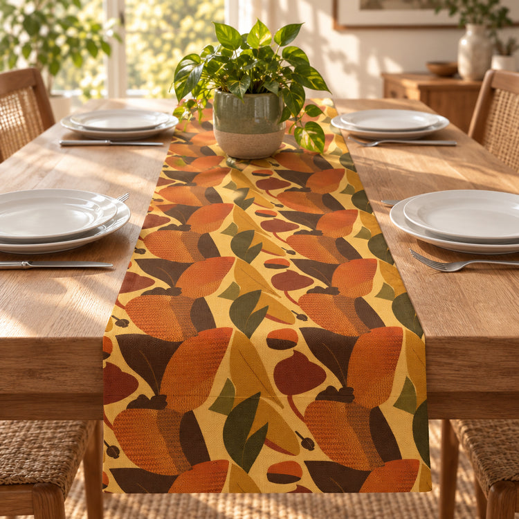 Table runner with abstract autumn leaves in orange, mustard, brown and olive.