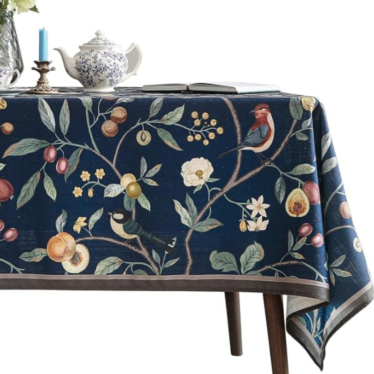 Navy tablecloth with colourful botanical vines and fruit motifs.