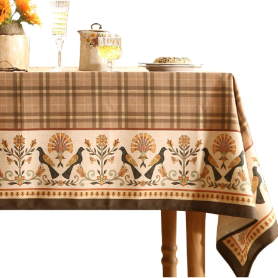 Brown checked tablecloth with a cream botanical border.