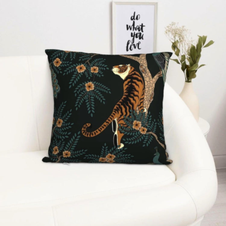 Dark green cushion cover with a golden tiger reaching among small flowers.