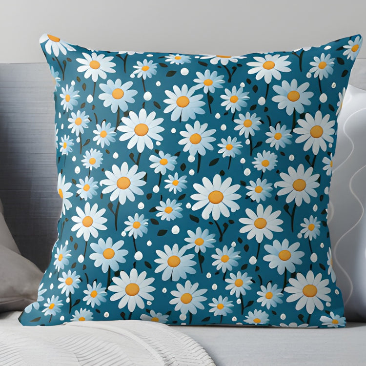 Teal cushion cover with small white daisies and yellow centres.
