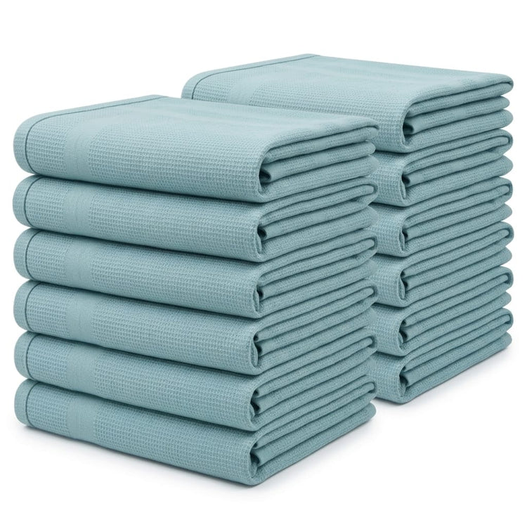 Two stacks of pale blue kitchen towels in different sizes.