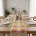 Bright multicoloured floral table runner with matching placemats.