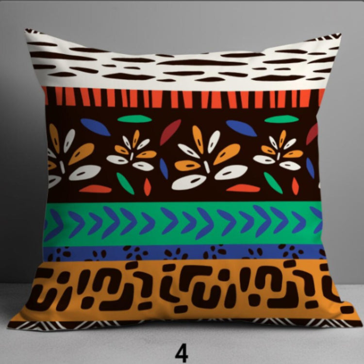 Cushion cover with colourful horizontal bands of leaves, geometric marks and animal-print shapes.