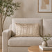Rectangular cream filled cushion with vertical stitched texture on a cream sofa.