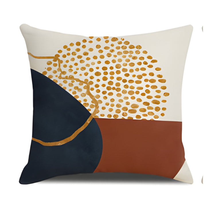 Cushion cover with a gold coloured dotted upper panel and navy and rust lower shapes.