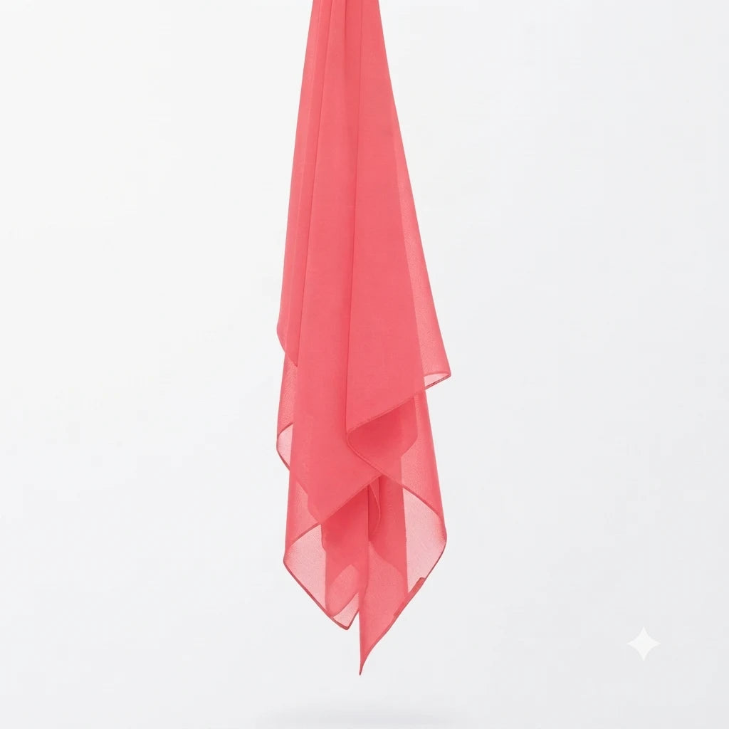 Coral chiffon stole hanging vertically to show its light fabric.