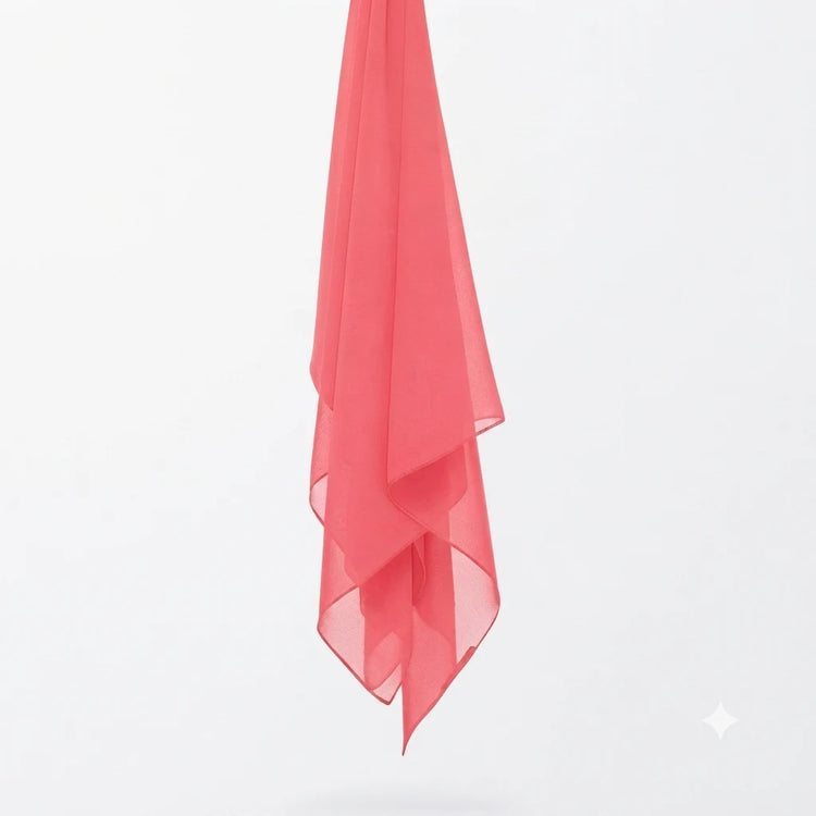 Coral chiffon stole hanging vertically to show its light fabric.