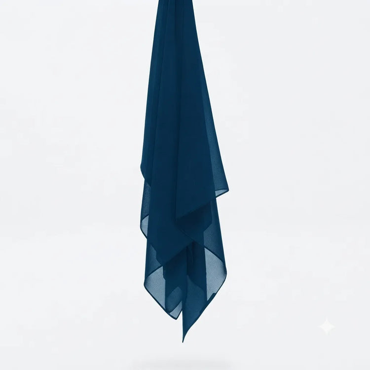 Teal chiffon stole hanging vertically to show its light fabric.