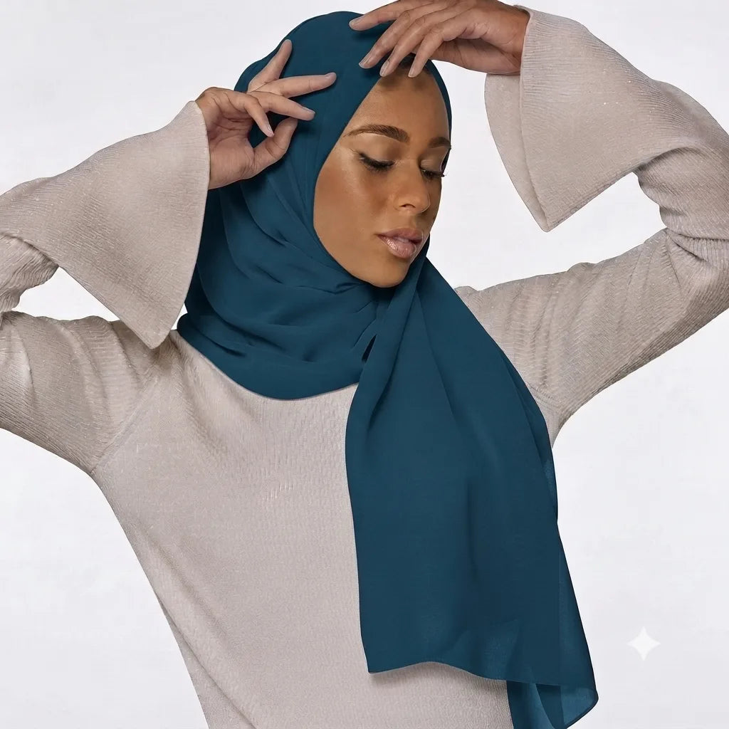 Model wearing a plain teal chiffon stole as a headscarf.