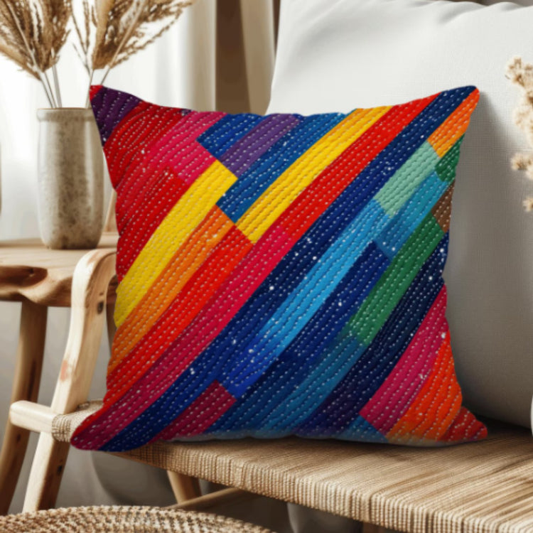 Cushion cover with vivid red, blue, green, orange and yellow diagonal bands.