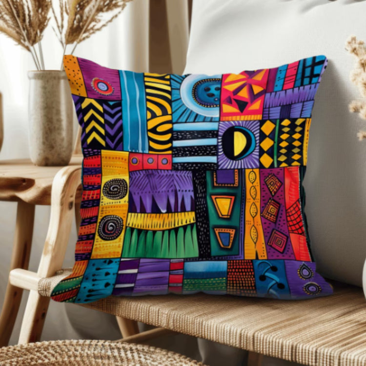 Cushion cover with colourful geometric patchwork panels, spirals and small motifs.