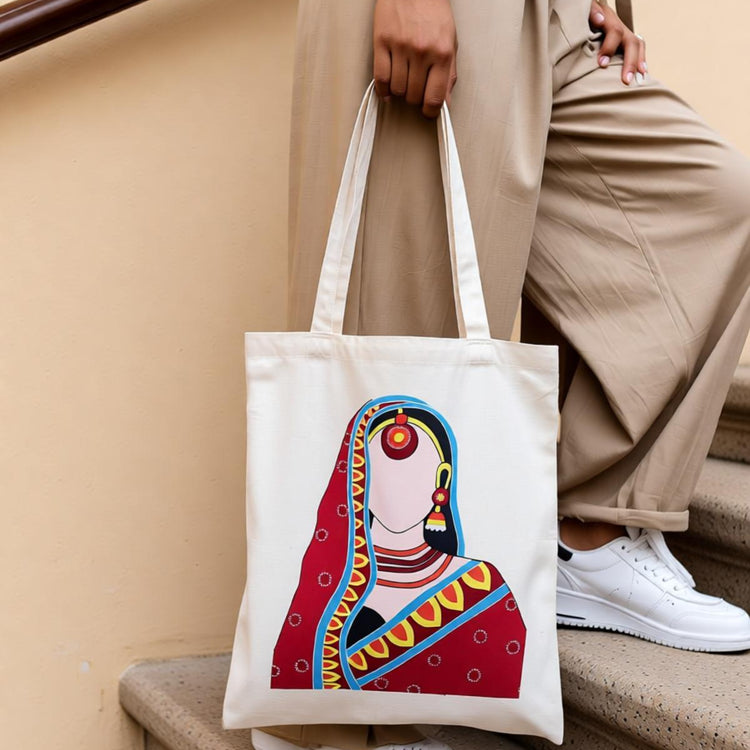 Cream tote bag with an illustrated woman in colourful traditional dress.