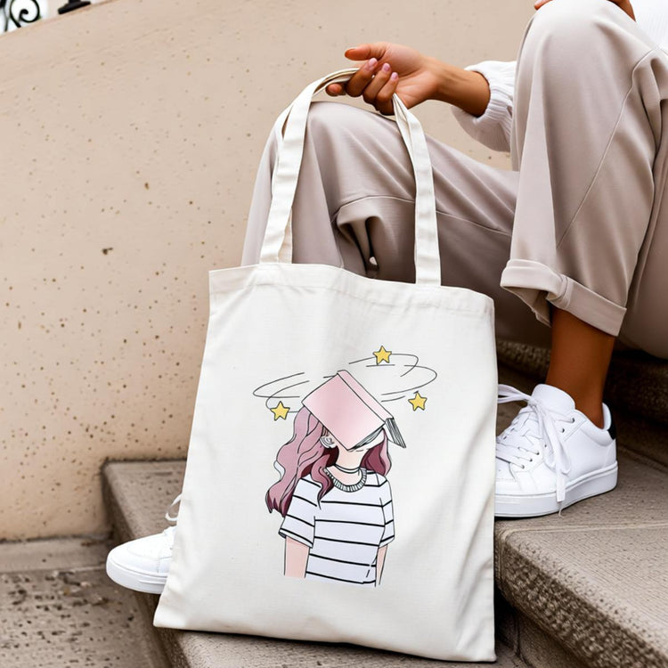Cream tote bag with a stack of books and a soft pink floral illustration.
