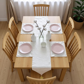 Cream textured table runner with matching placemats.