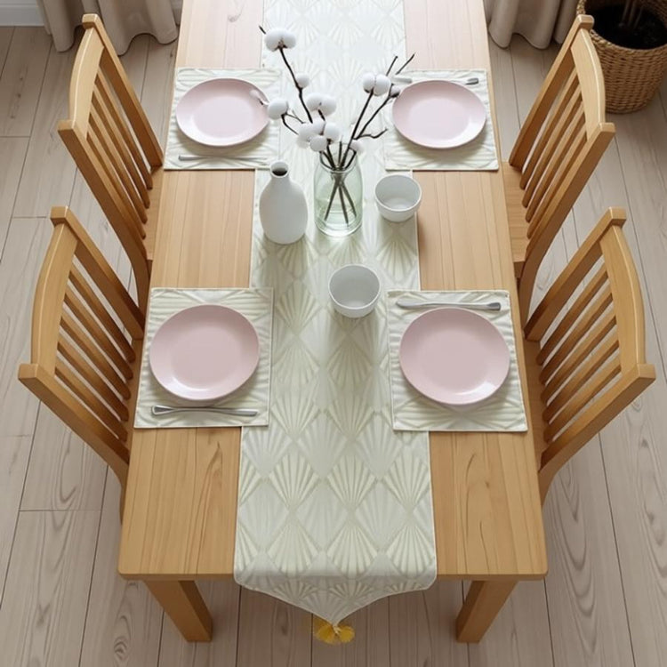 Pale gold table runner with radiating geometric lines and matching placemats.