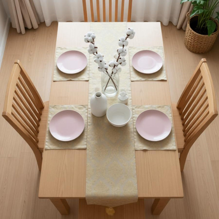 Pale silver textured table runner with matching placemats.