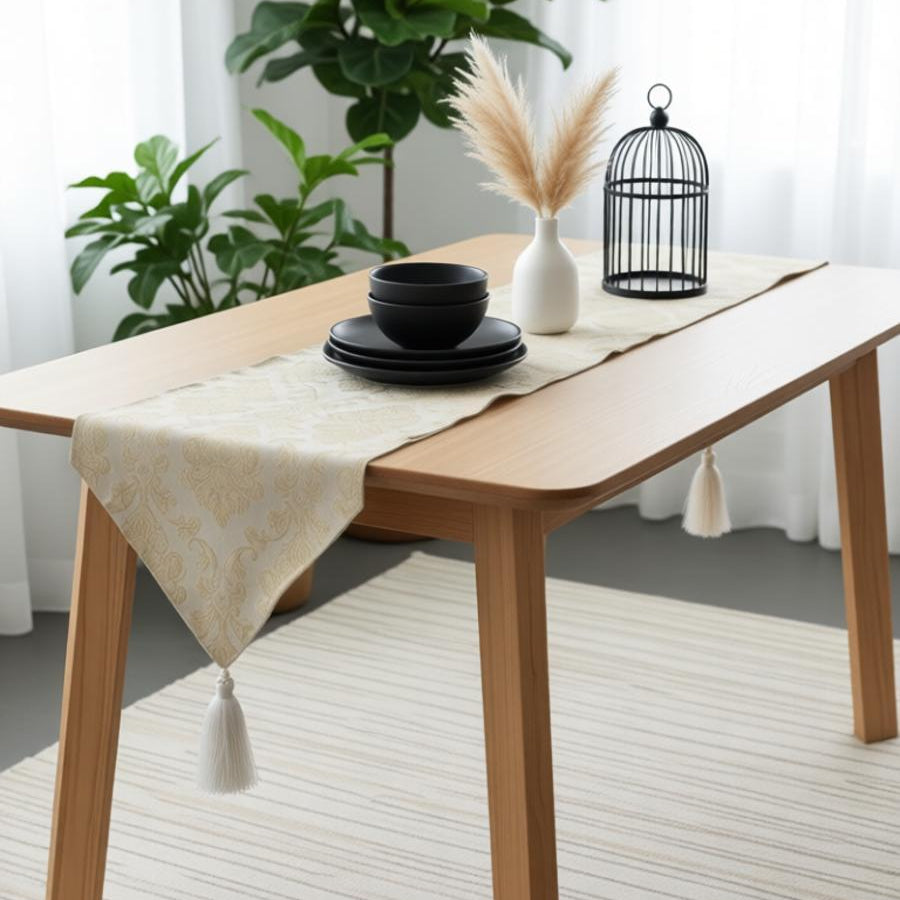 Pale silver textured table runner with a pointed end.