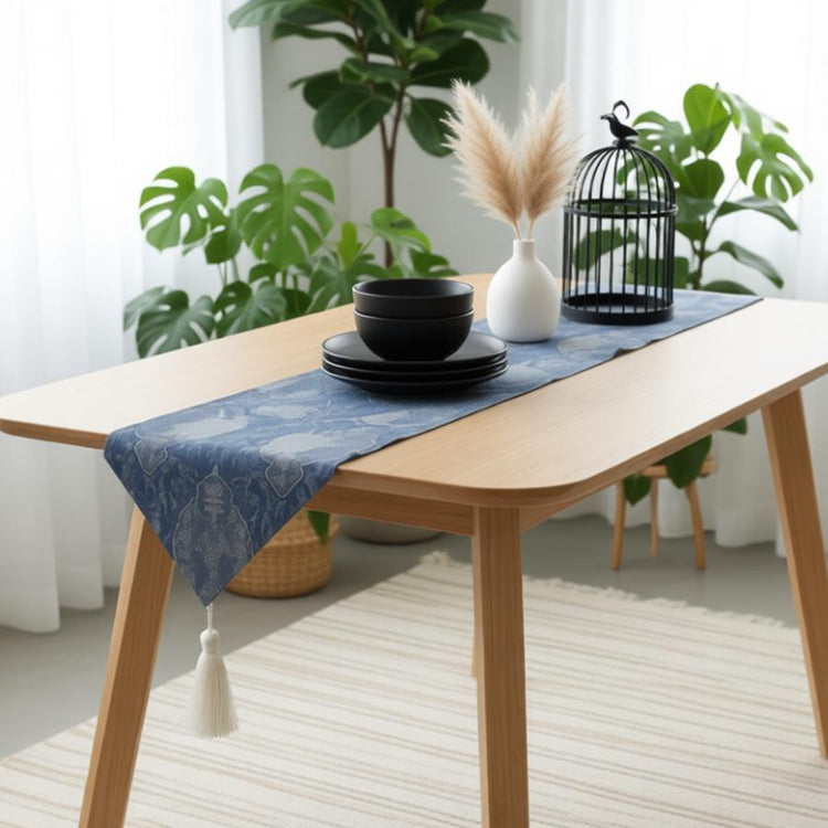 Dark blue ornamental table runner with a gold-coloured tassel.
